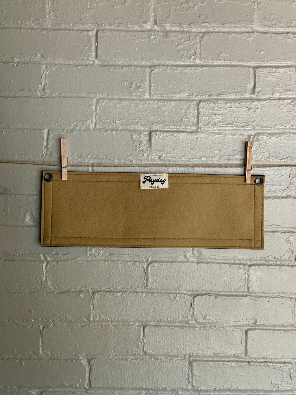 Back of a light brown banner with black trim and double printed red and black lettering reading "BIRDWATCH"