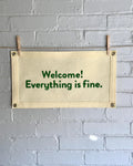 Cream felt banner with green lettering referencing The Good Place reading "Welcome! Everything is fine."