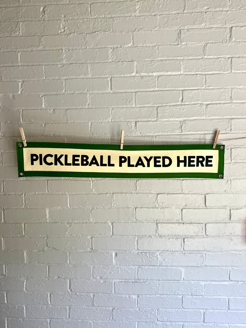 A long felt banner reading "PICKLEBALL PLAYED HERE" 