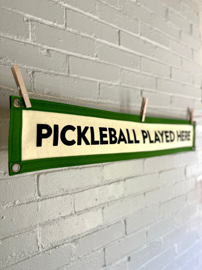 A long felt banner reading "PICKLEBALL PLAYED HERE" 