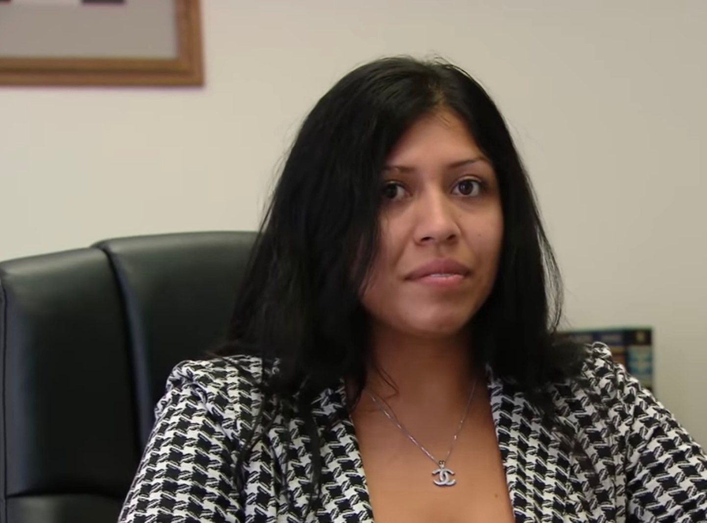 Scene from Nathan For You, showing a woman reacting to the camera while interviewing Nathan Fielder