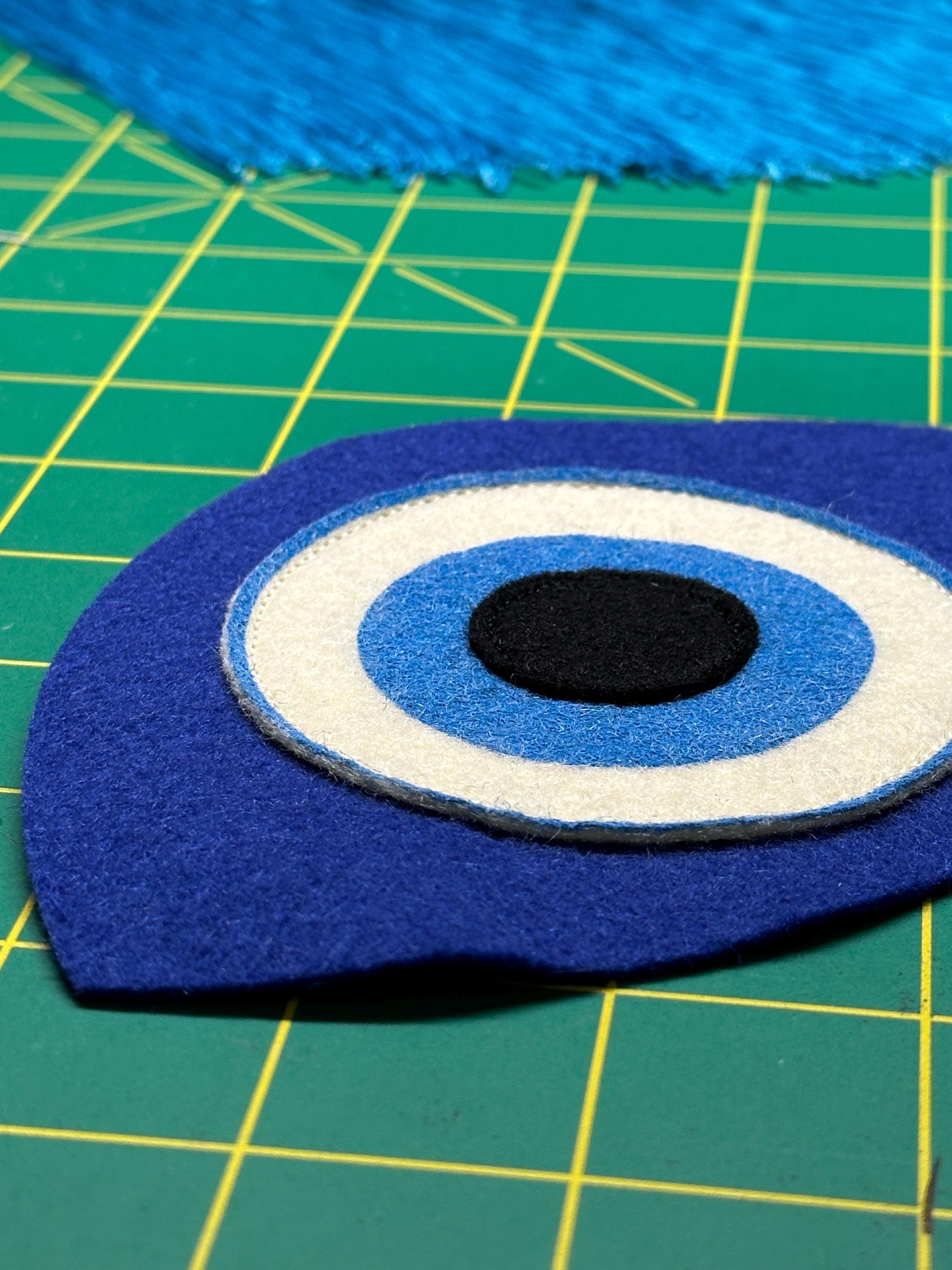 An incomplete felt "evil eye" in progress