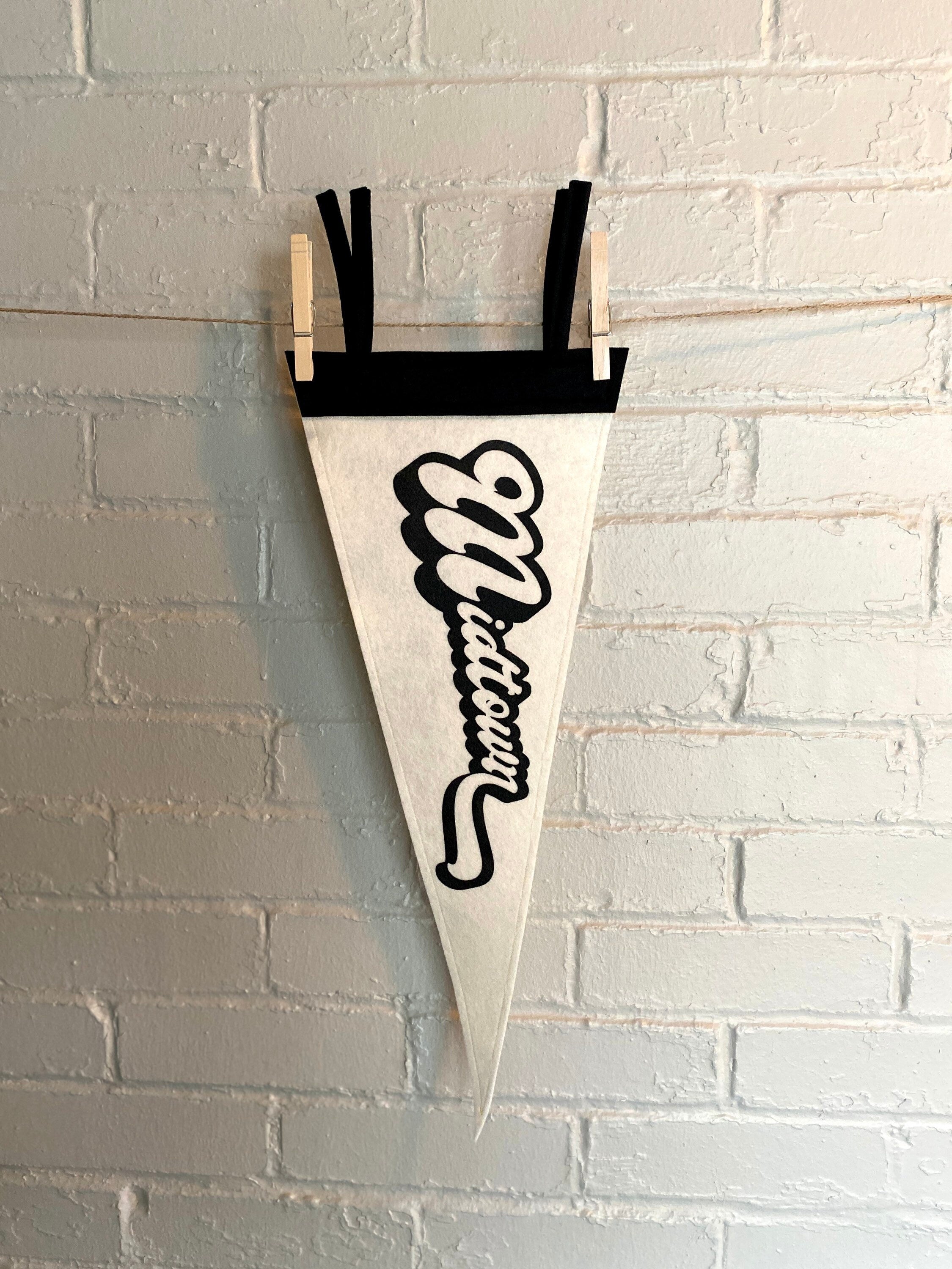 A black and white pennant that reads "Midtown" with the pennant vertical